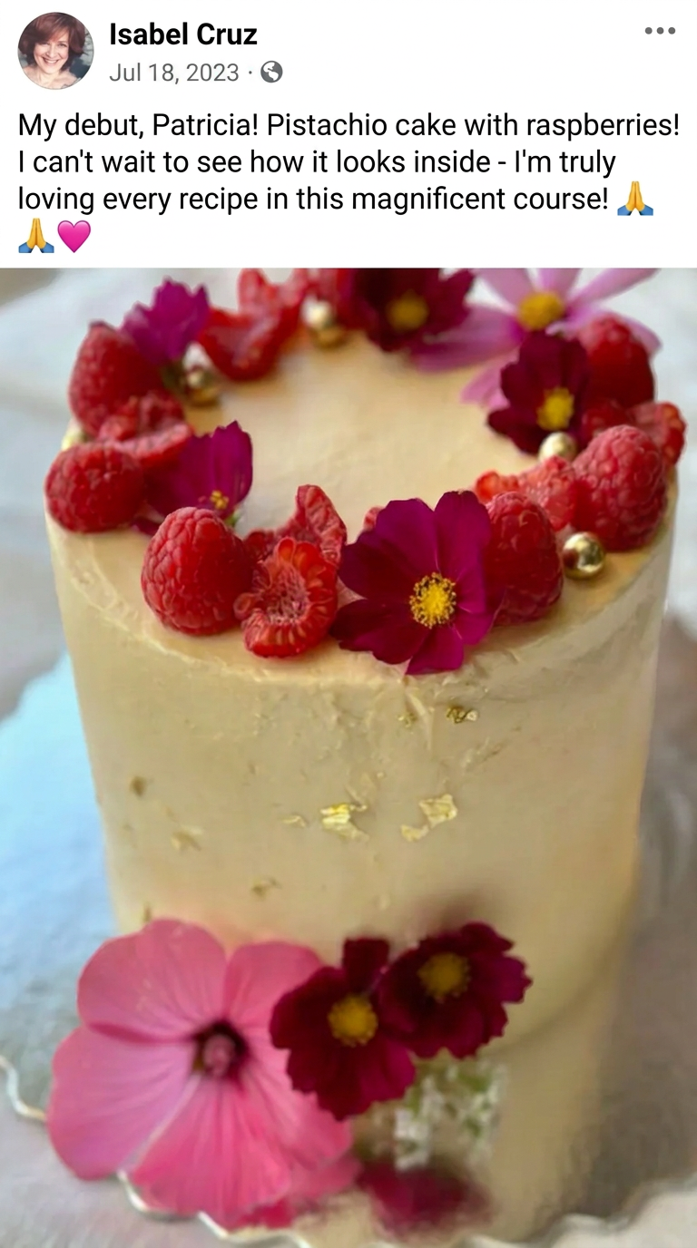 Pistachio cake with raspberries and edible flowers made by a student